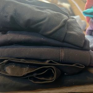 Stack of black leggings